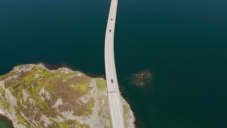 atlantic ocean road, norway. bridge across fjord with clear blue and turquoise sea water at kristiansund