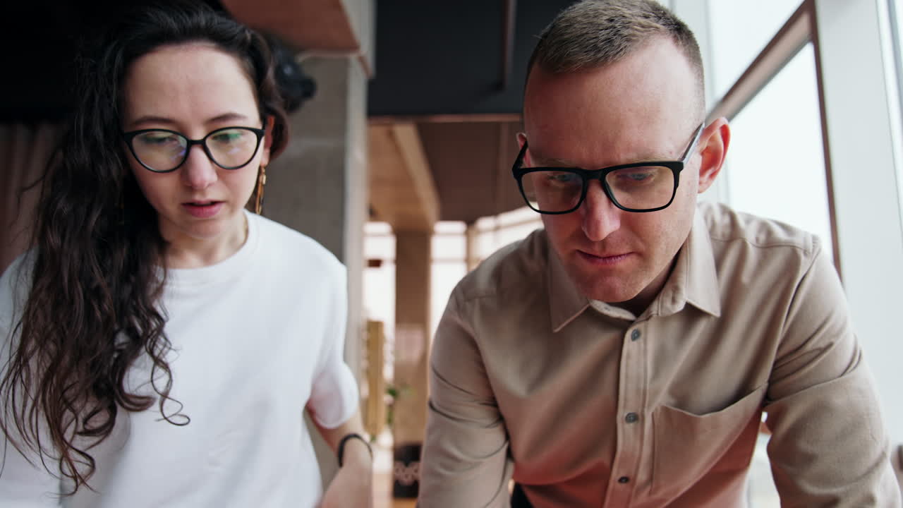 Active discussion of job issues. Male and female communicating, disputing and disagreeing. Low angle view.