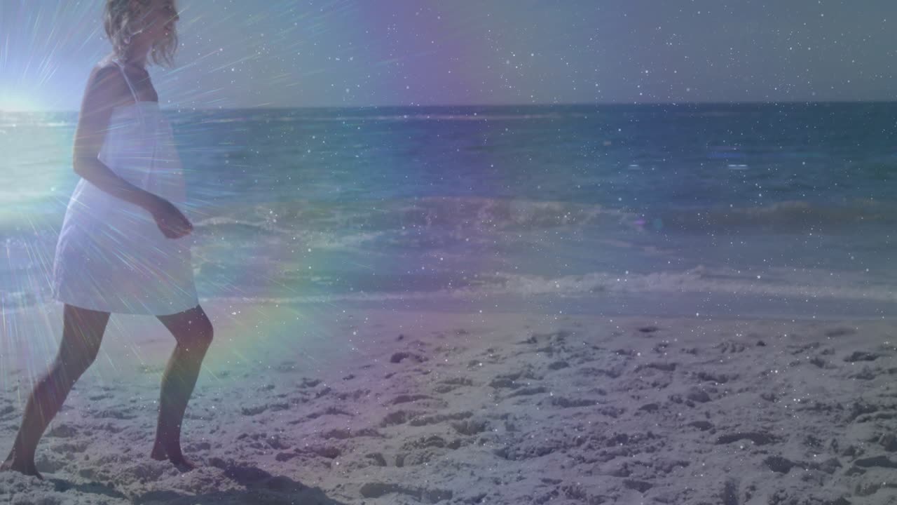 Model woman entering from left then stepping and skipping along sandy shore to showcase summer joy