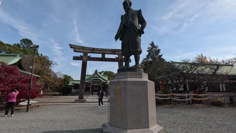 visitors walking through a traditional shrine gate