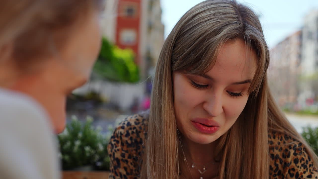 Conversation between two women outdoors