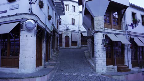 cobblestone narrow alleys through beautiful old traditional buildings in bazaar of gjirkastra