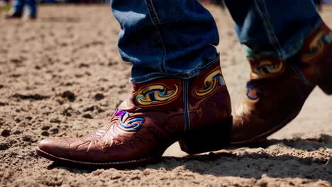 cowboy boots dancing in the sand