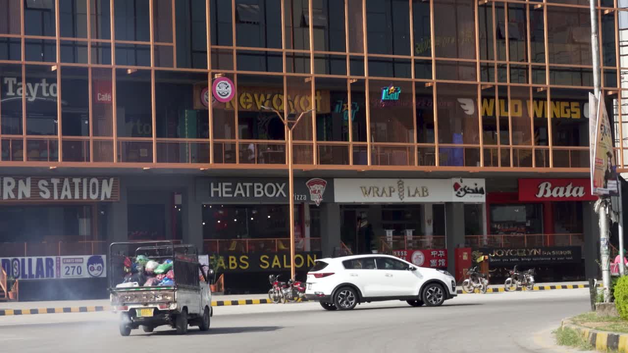Busy Street Scene in a City with Shops and People