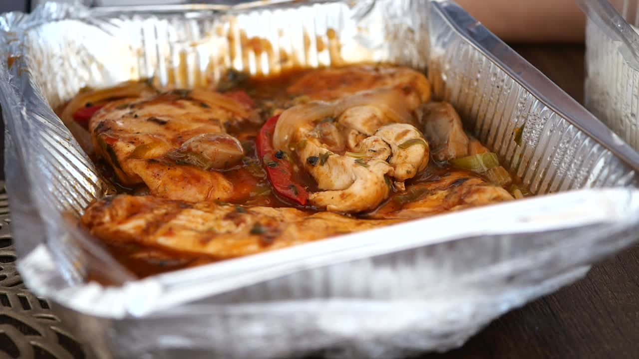 Chicken dish in a disposable container