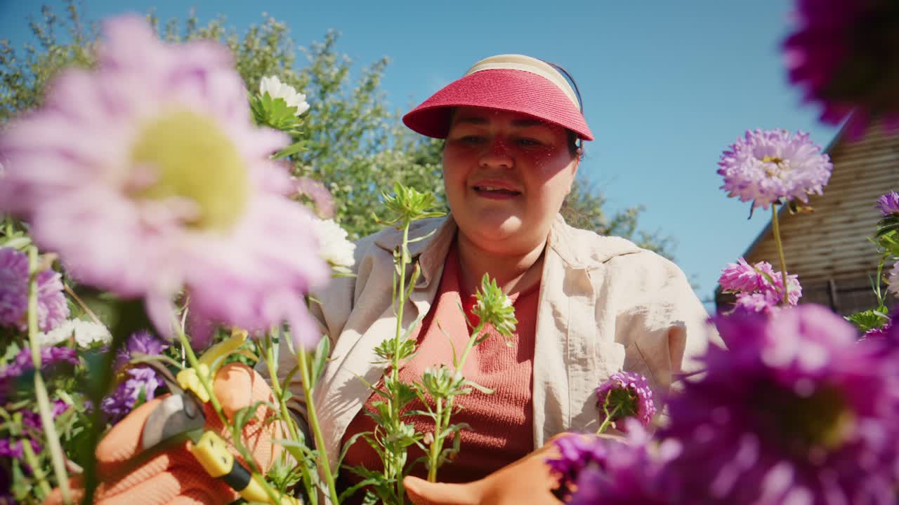 A Gardener Nurturing Beautiful Purple Flowers Under Clear Blue Skies, Embracing Nature's Beauty with a Cheerful Smile, Surrounded by Vibrant Blooms