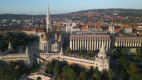 sliding aerial shot reveals matthias church, fisherman's bastion, holy trinity square