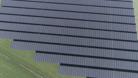 Drone-aerial-shot-of-solar-panels-on-a-field