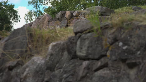 A-close-up-view-of-a-boundary-wall-made-of-stone-of-a-fortress