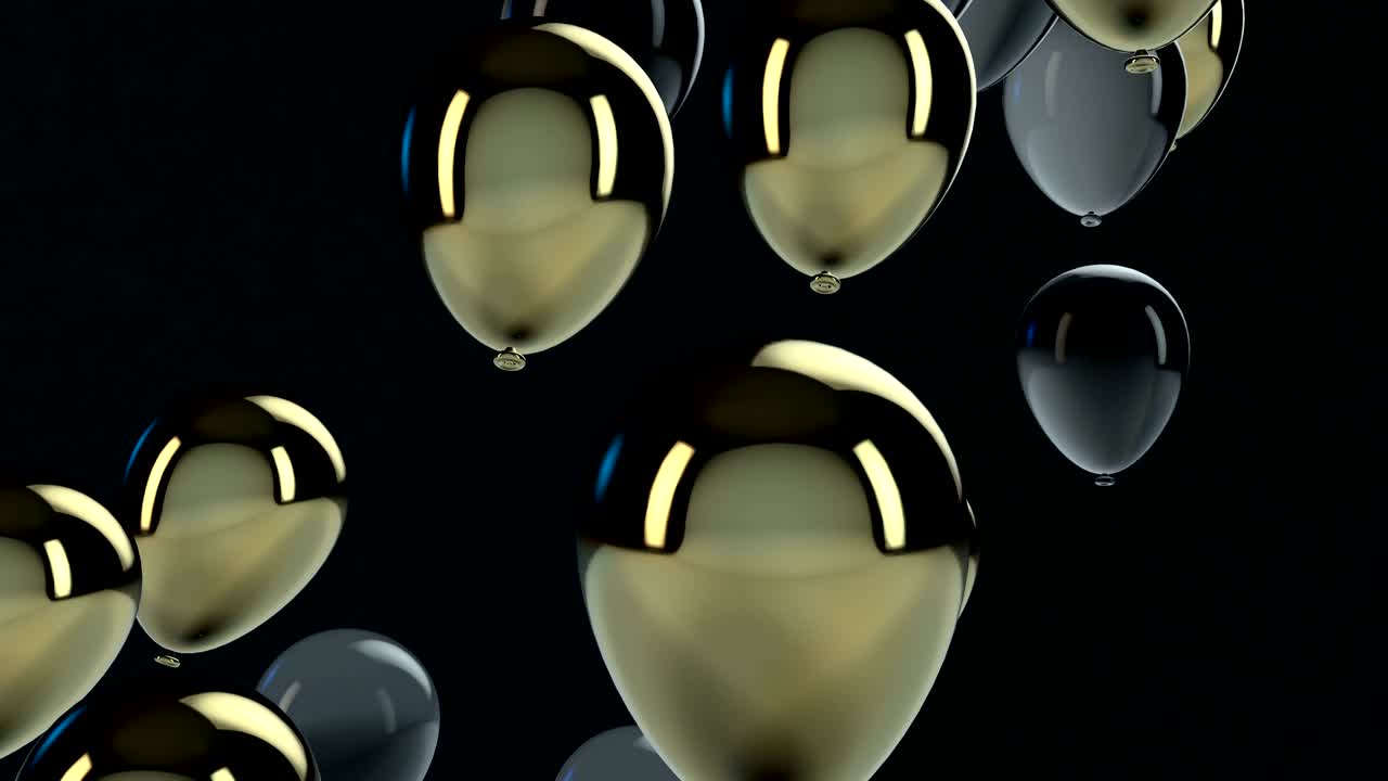 un globo dorado y negro flotando en el aire