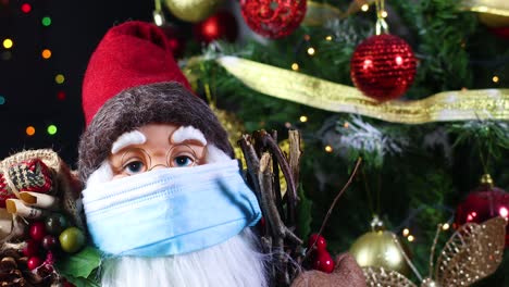 close up of santa clouse with face mask and christmas tree