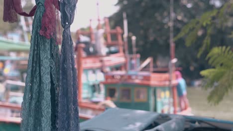 lacy-scarfs-and-blurred-ocean-bay-with-moored-boats-on-day