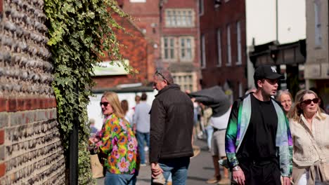 people walking along a lively street