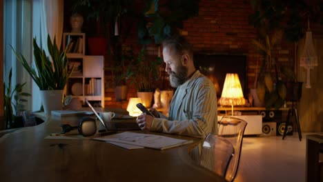 man working at home at night
