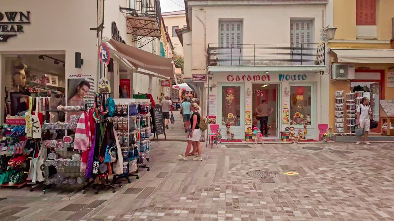 A Lively Street Scene in a Greek Town
