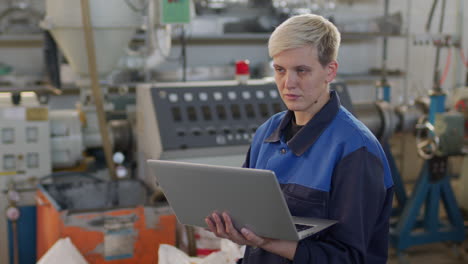 female plant worker with laptop