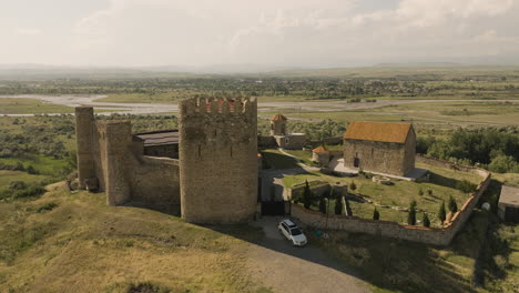 Medieval-stone-castle-fortress-in-Samtsevrisi-in-sunlight,-Georgia