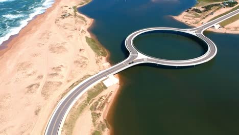 Aerial,-drone-footage-from-the-round-Garzon-Bridge,-Maldonado,-Uruguay