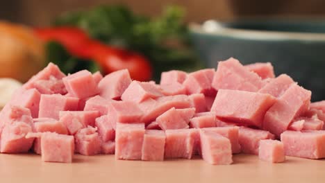 ham italian mordatella, man slices of traditional italian antipasti mortadella sausage on a wooden cutting board, close up macro of chicken or turkey jamon, fat breakfast dish.