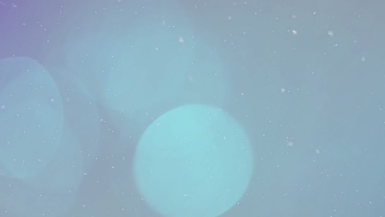 Animation of snow over light spots on grey background