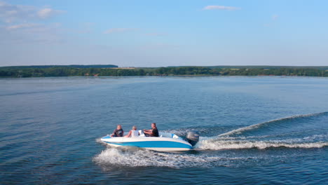 boat floating on the river. drone flying above river with driving speedboat