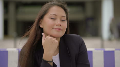 beautiful young woman smiling at camera outdoor