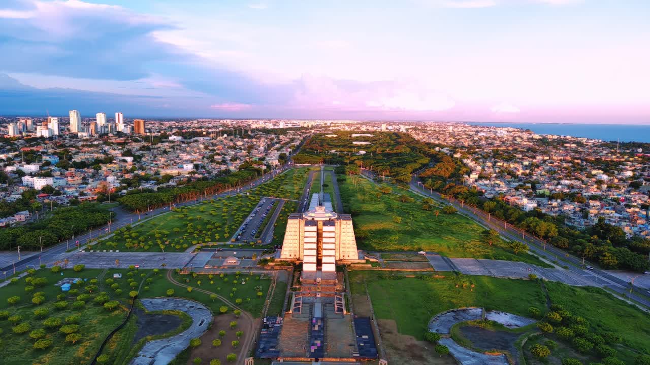 Drone footage capturing the iconic Columbus Lighthouse at dusk, showcasing its cross-shaped structure in Santo Domingo, Dominican Republic