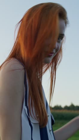 woman with red hair outdoors