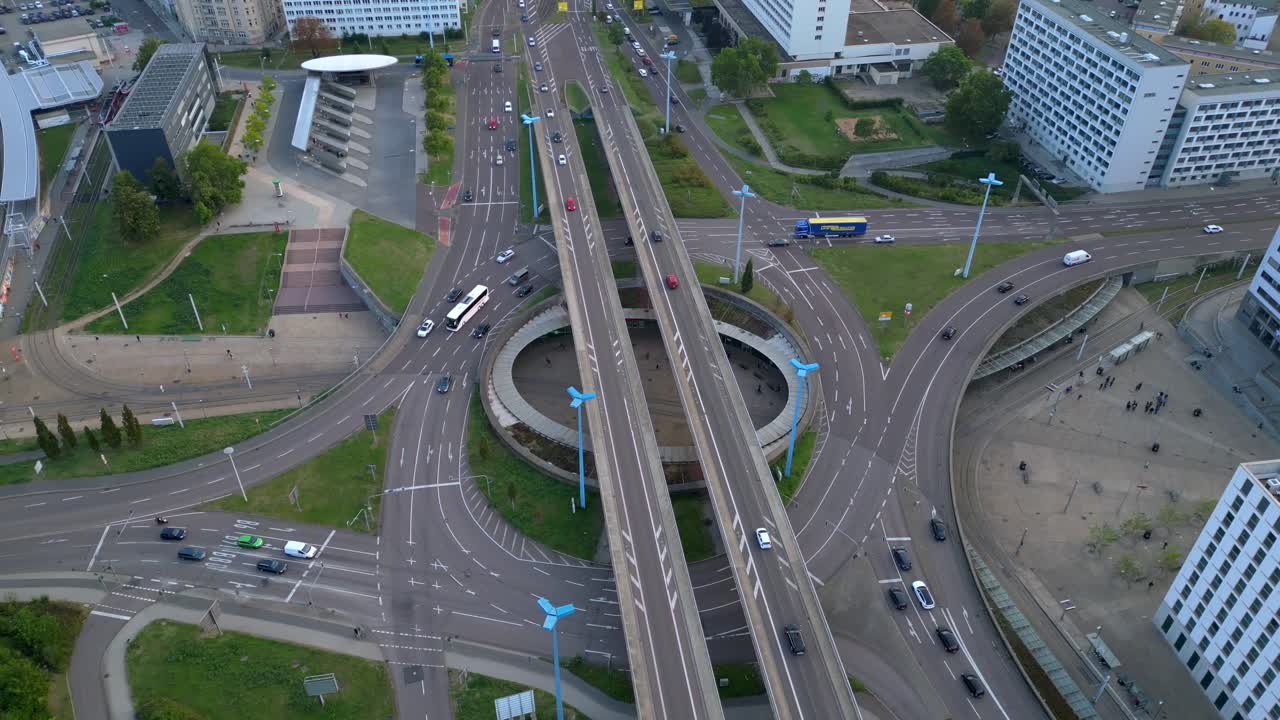 highway roundabout passing over halle saale germany on a cloudy summer day. wide orbit overview drone