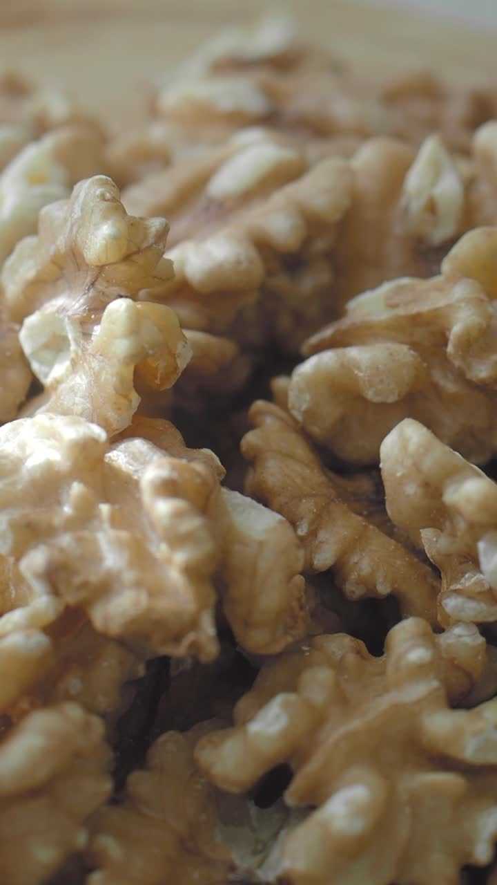 Close-up View of Shelled Walnuts Moving Slowly