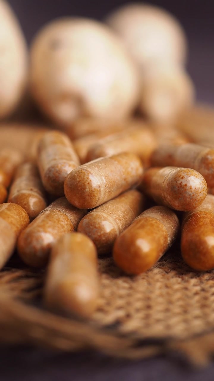 Close-up of Herbal Supplement Capsules on Burlap