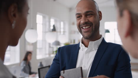 confident businessman meeting clients professional business people discussing partnership deal in startup office workspace
