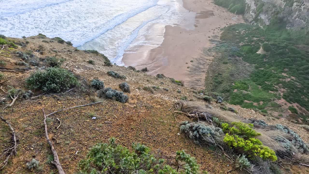 Waves crashing against cliffs at Great Ocean Road