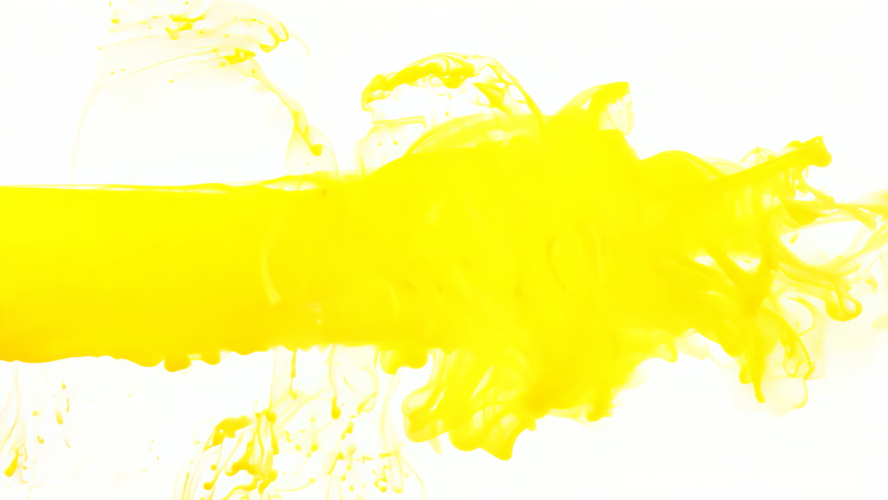 Bright Yellow Paint Splashing on White Background. A vibrant yellow paint splashes across a clean white surface, creating dynamic textures and patterns.