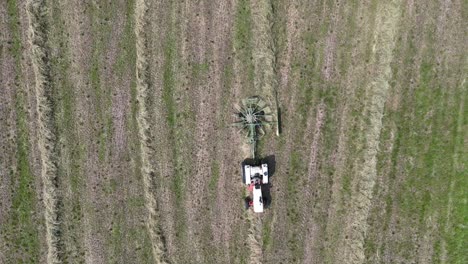 A-farmer-rakes-hay-in-Northeast-Wisconsin-making-it-ready-for-baling