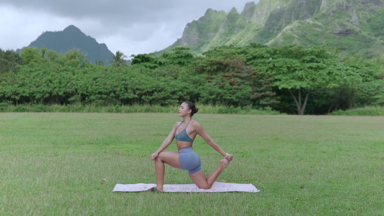 Fitness model doing yoga, leg bend