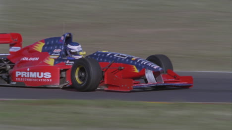 a formula car drives on a circuit track 8