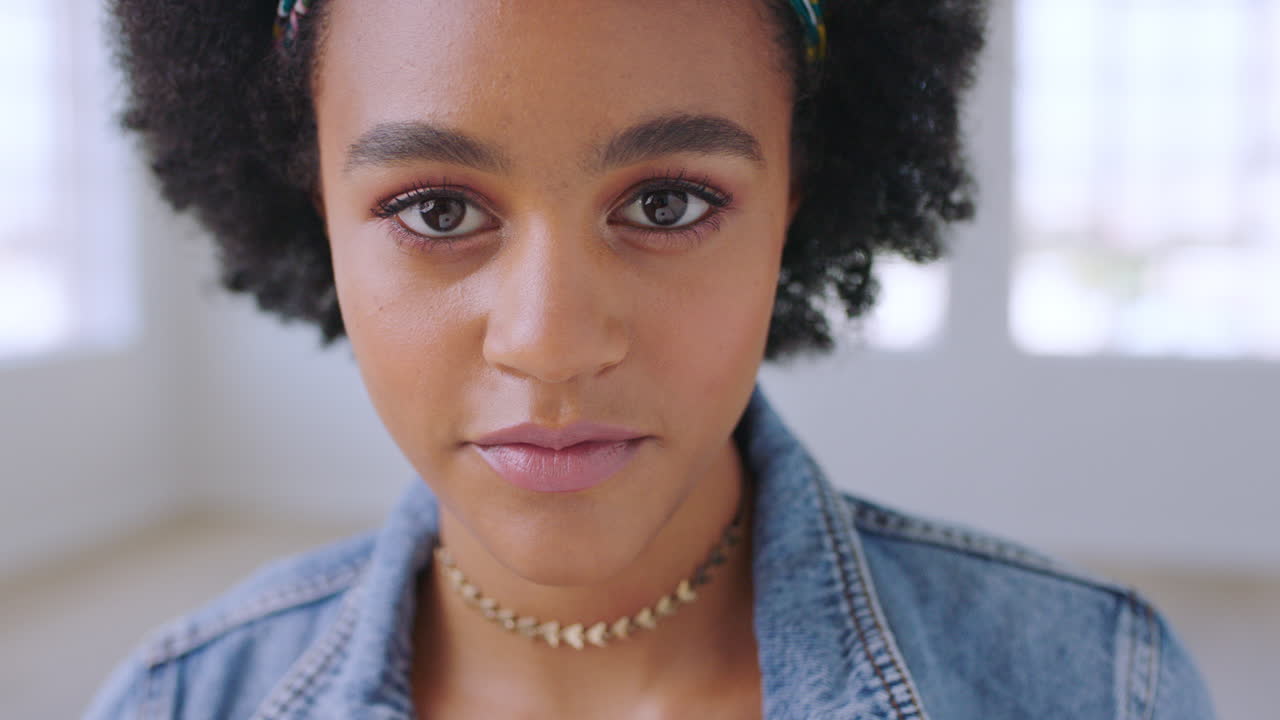 Black woman, face and serious portrait with afro