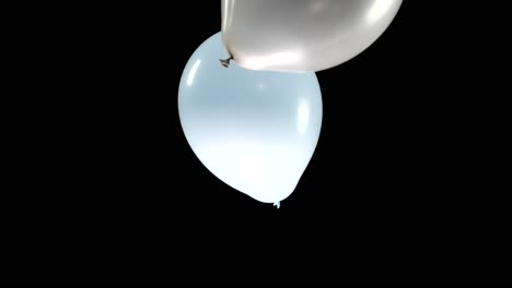 watch as multi-colored balloons fall through the display, creating a playful and dynamic visual. perfect for adding energy to any project, the green screen allows for versatile use in creative edits.