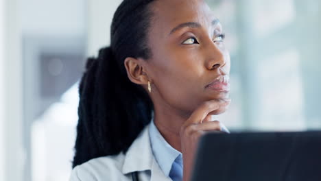 Doctor, thinking and woman with research on laptop