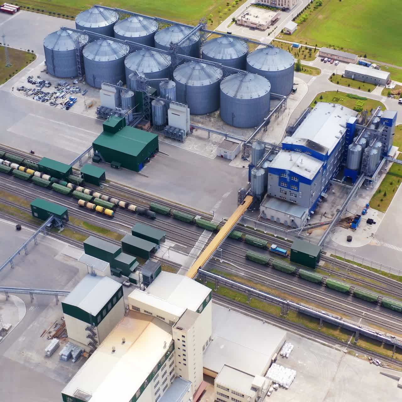 Huge metal construction of grain elevators. Storage tanks equipment for storing and processing grains