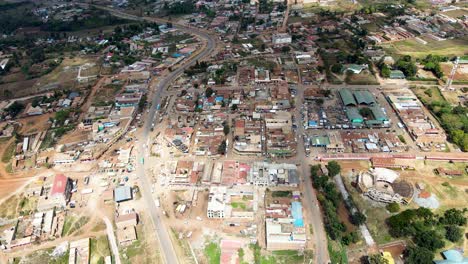 Rural-settlement-Africa--Aerial-flyover-poor-Kibera-Slum-and-modern-skyline-of-Nairobi-in-background-during-sunny-day