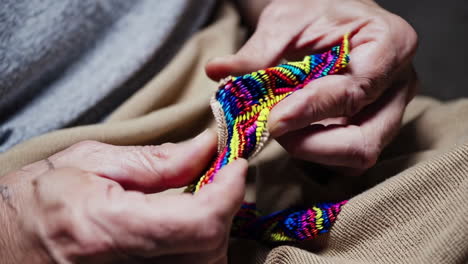 close up of hands crafting on a loom