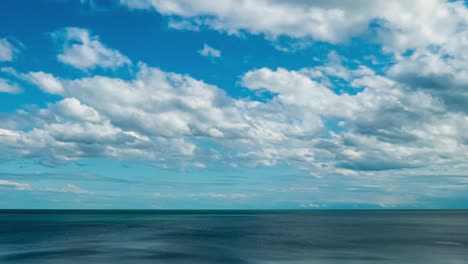 beautiful blue sky with clouds background timelapse loop. white rolling, fast motion time lapse clouds in horizon. 4k cloudscape loop time lapse