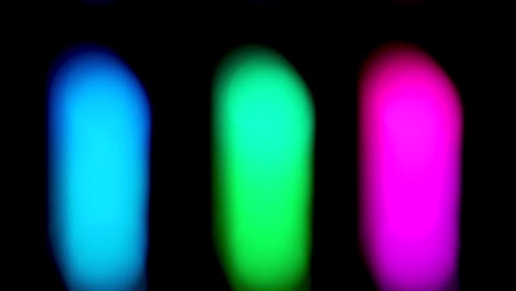 defocused pulsating colorful strip lights bokeh shape against dark background