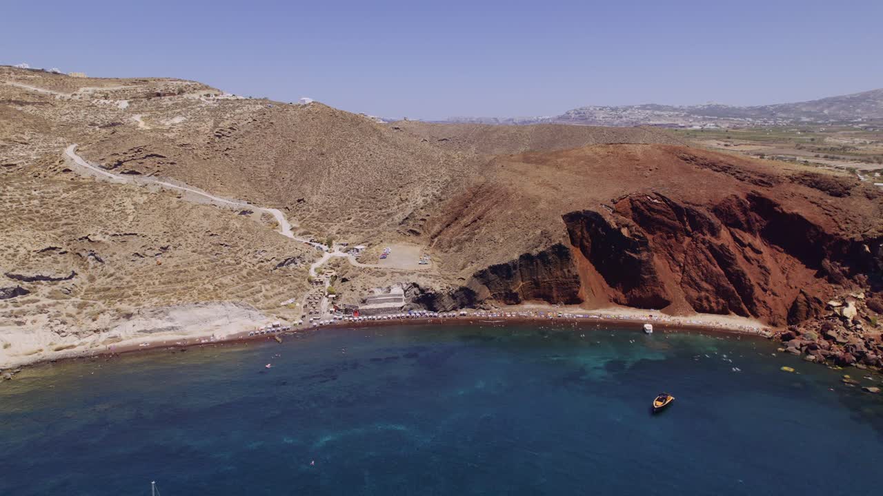 Aerial View of Red Beach in Santorini, Greece with Swimmers and Boats