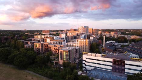 Establishing-wide-angle-drone-shot-of-London-suburb-at-sunset,-UK