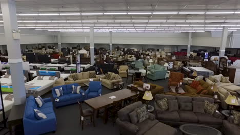 Drone-shot-inside-a-furniture-store,-wide-shot