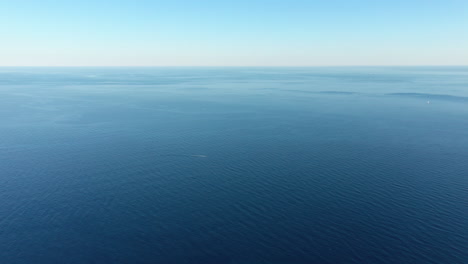 aerial back traveling over the mediterranean sea calm sunny day sausset les pins