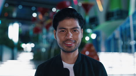 portrait of a man in a city at night